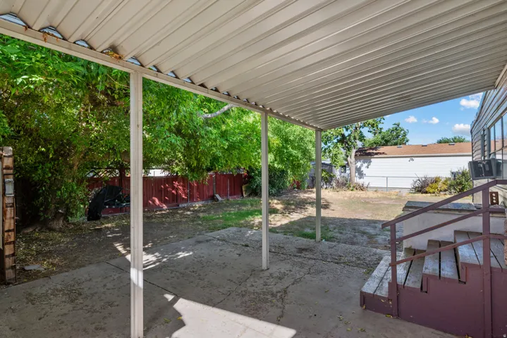 Expansive covered patio with concrete flooring
