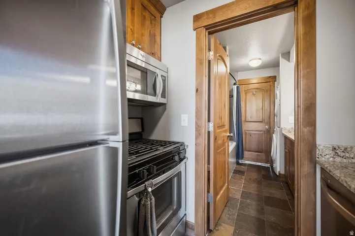 Stainless steel refrigerator and range with an over-the-range microwave