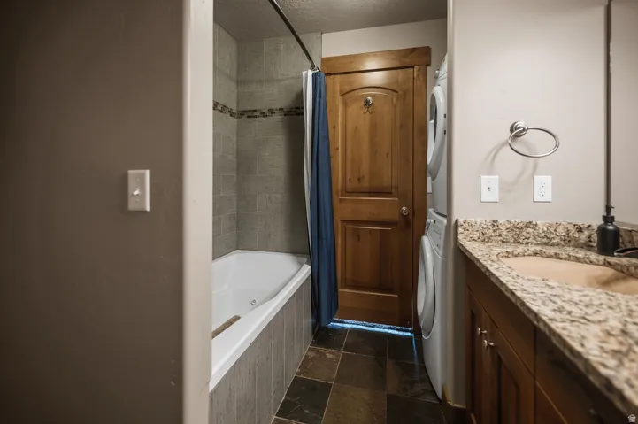 Built-in bathtub with tiled surround and decorative accent band