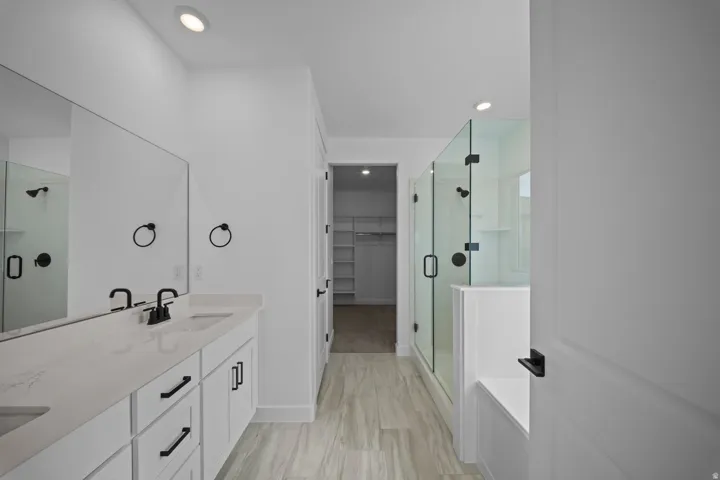Dual vanity with undermount sinks and light-toned countertops