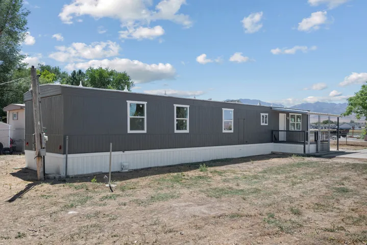 Dark gray horizontal siding with white trim
