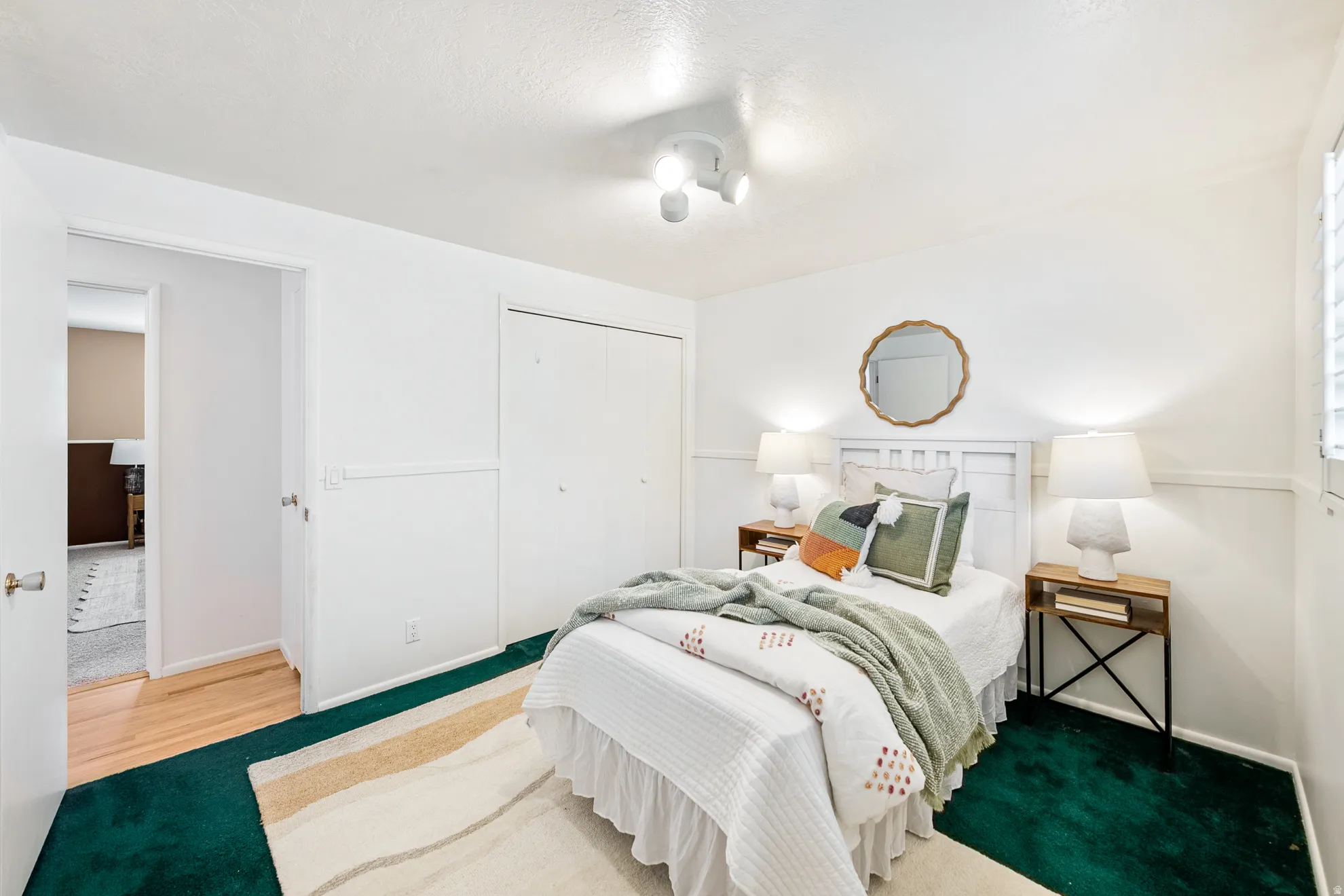 Spacious bedroom with fresh paint and plantation shutters