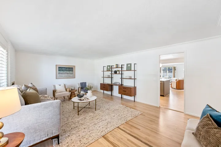 Wood-finish flooring throughout, white walls, and a recessed opening