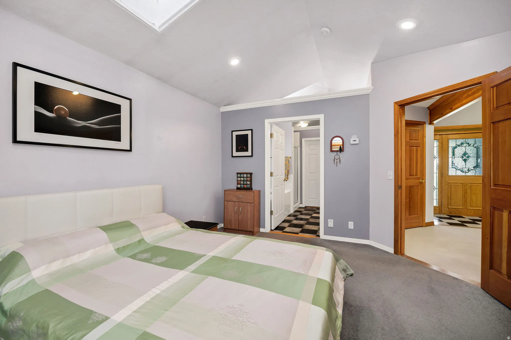 Vaulted ceiling with skylight and recessed lighting