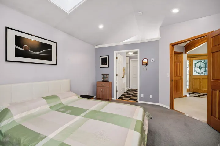 Vaulted ceiling with skylight and recessed lighting
