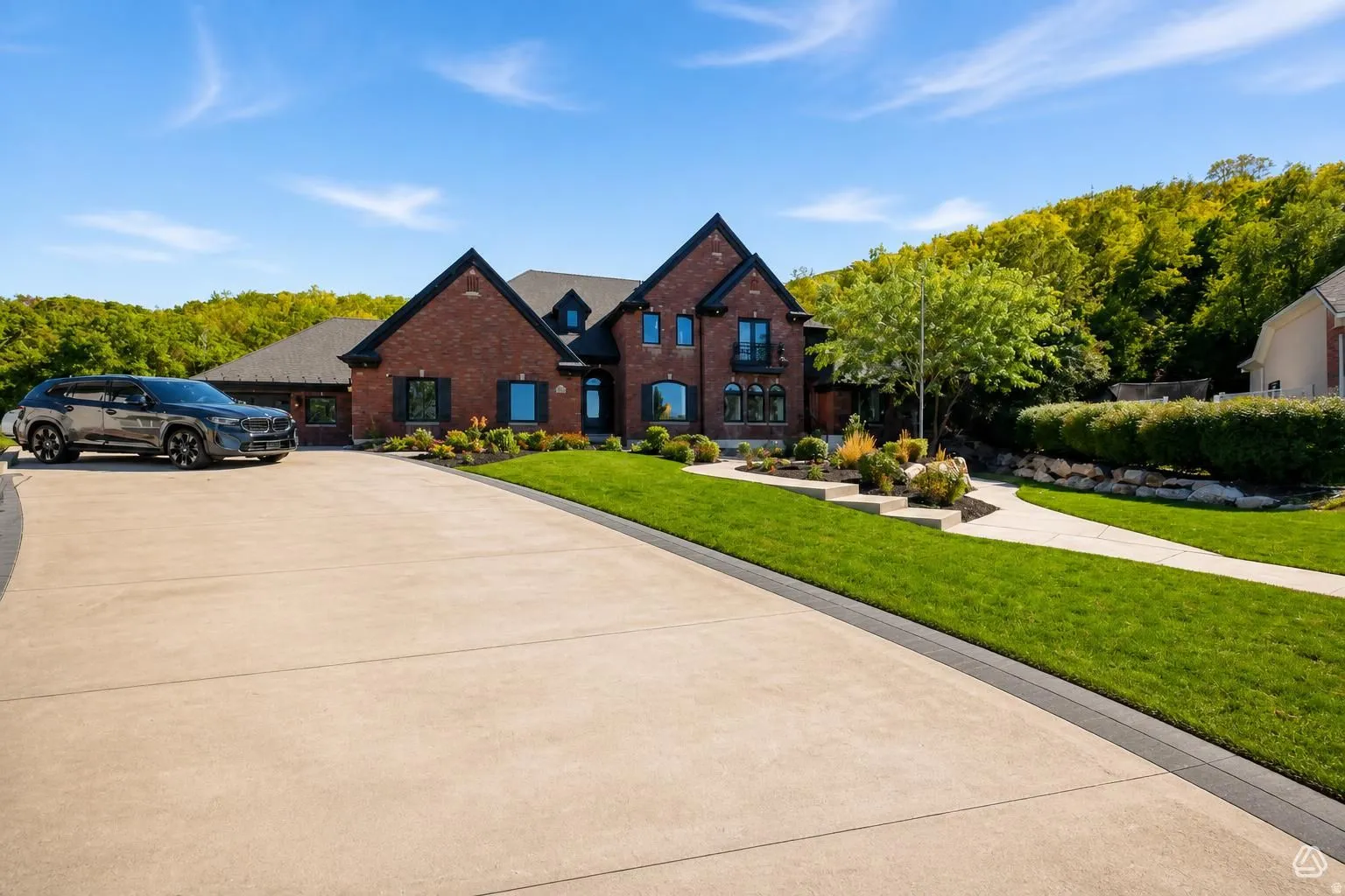 Brick exterior with black shutters and a black roof