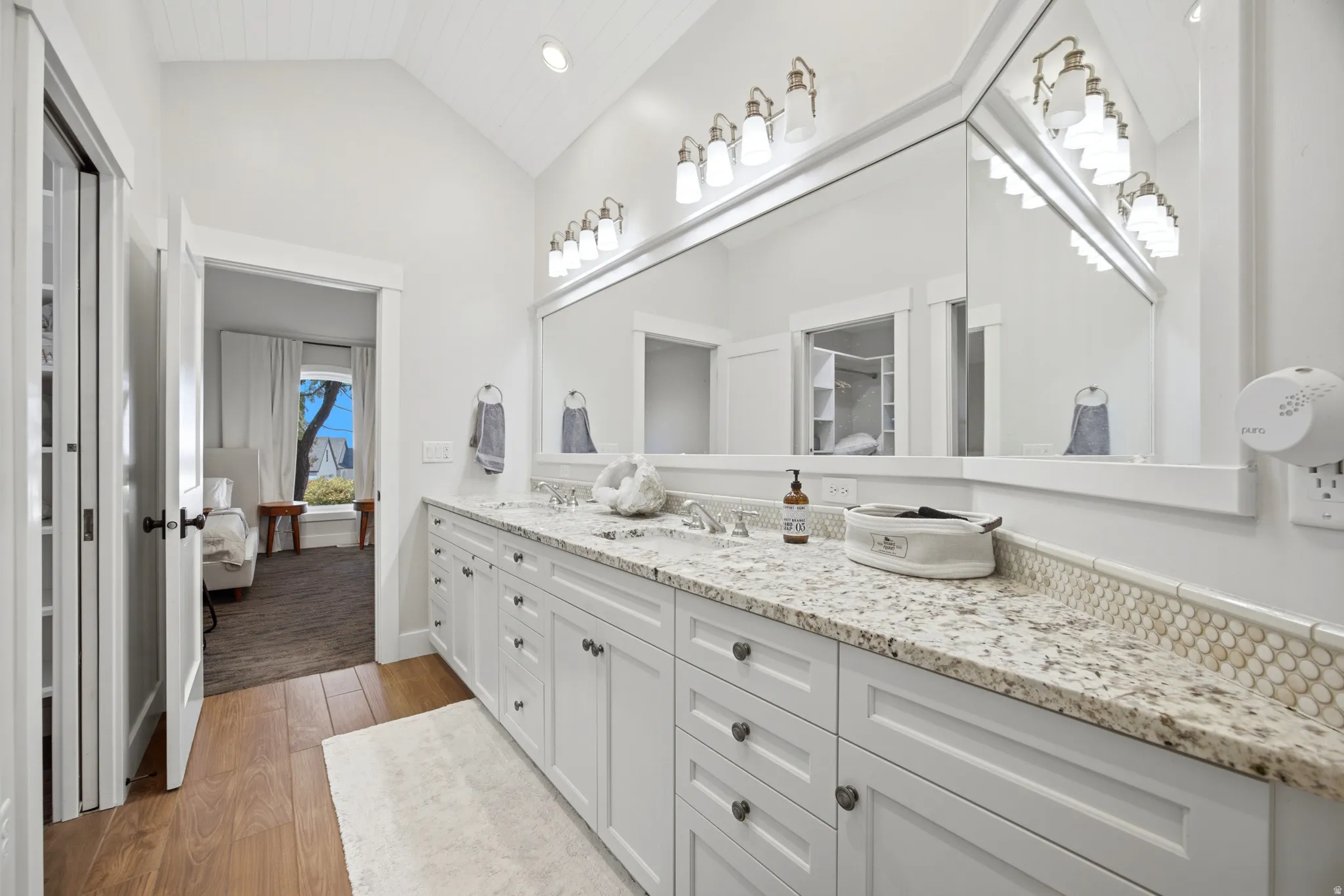Dual vanity with light-toned countertop and integrated sinks