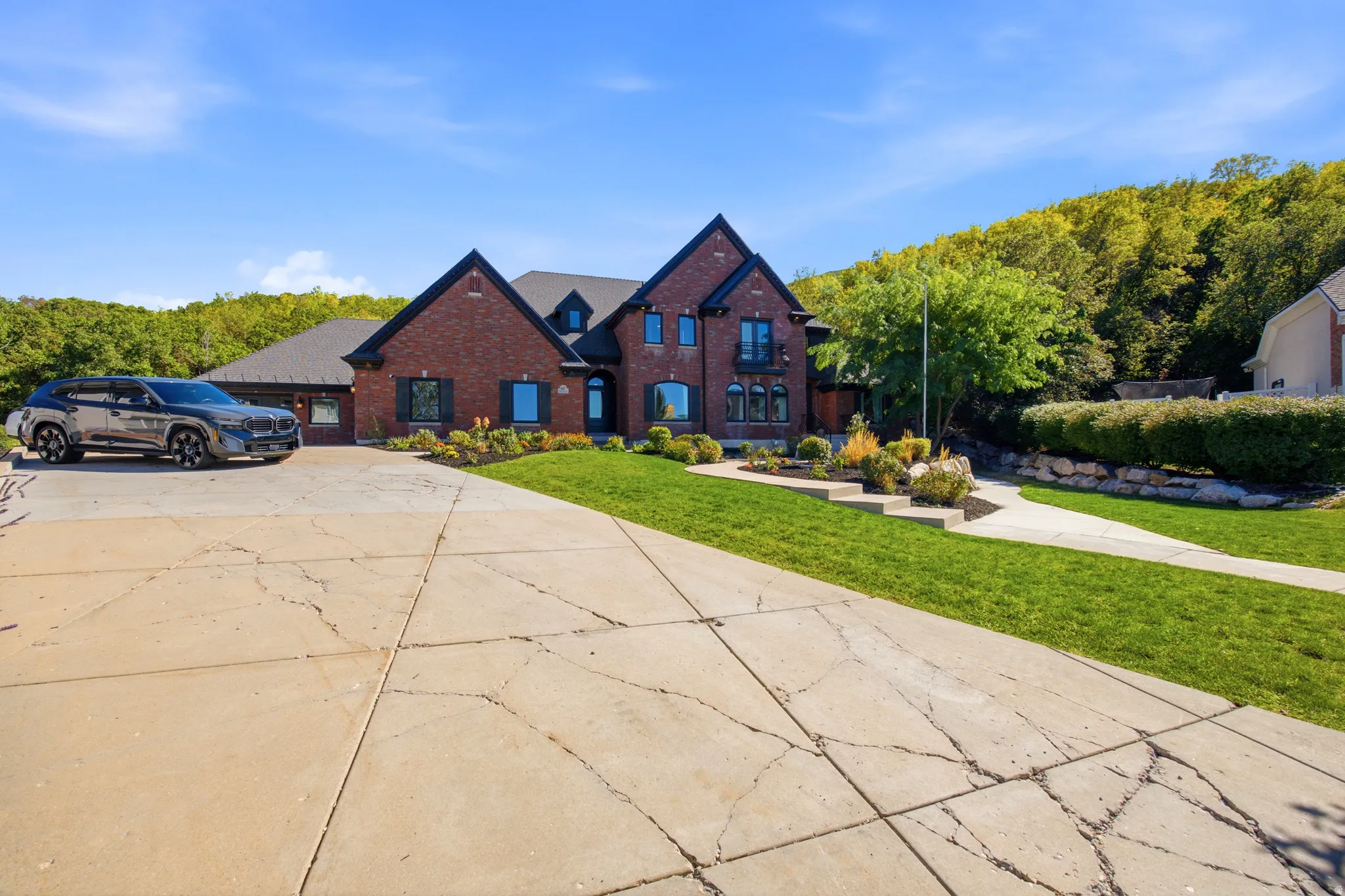 Brick exterior with black trim accents and multiple gables