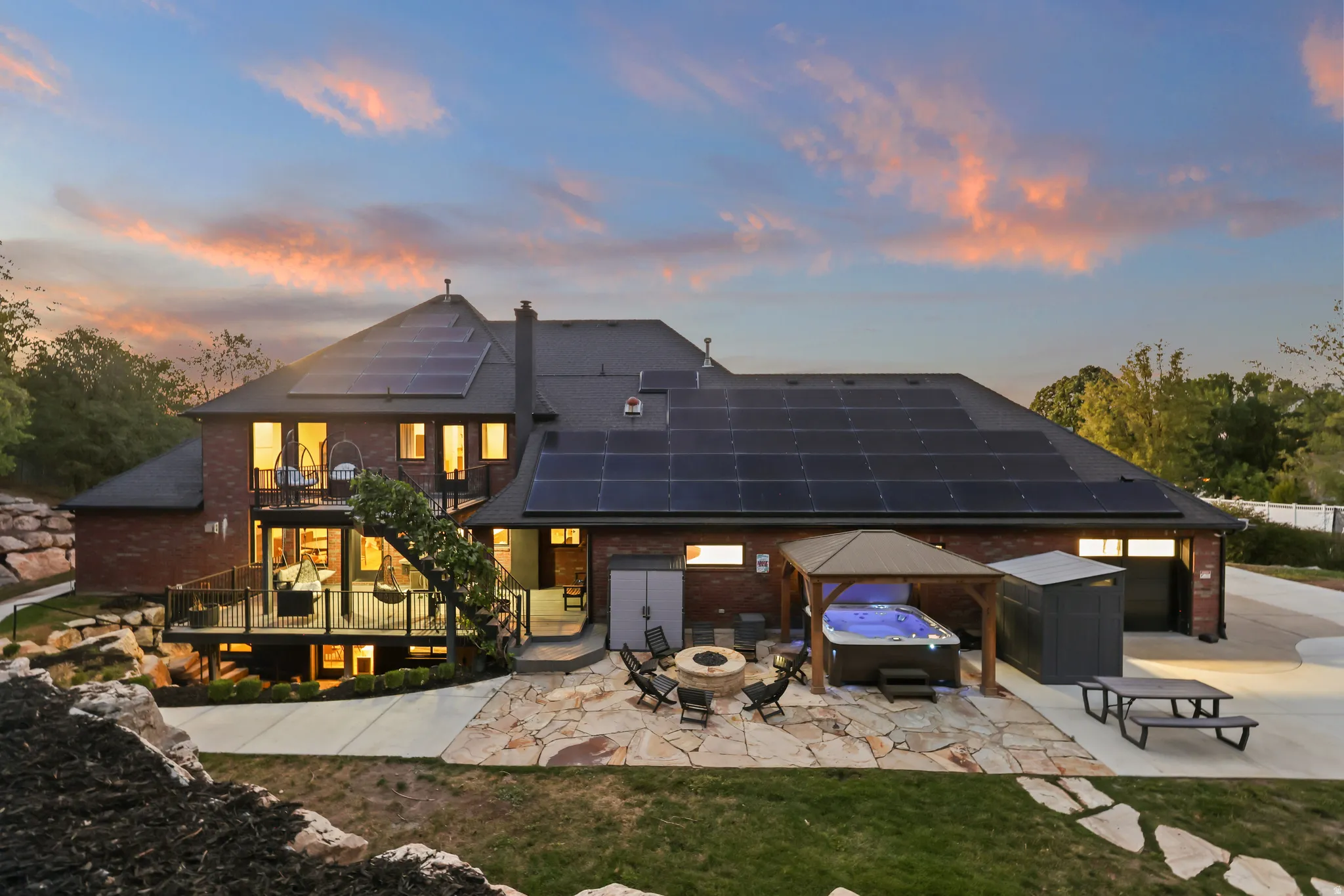 Brick exterior with multiple solar panel arrays