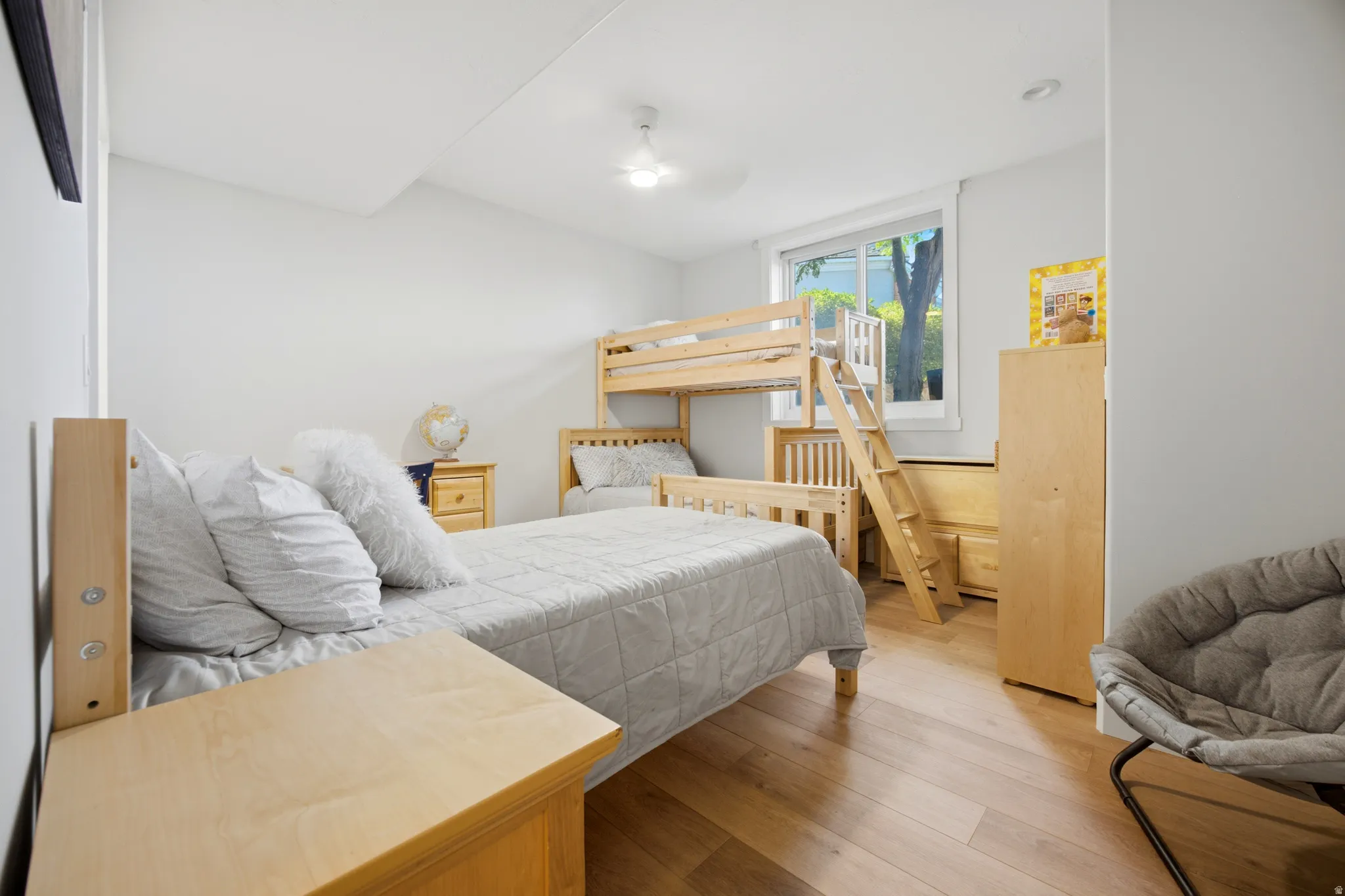 Light-filled room featuring wood-finish flooring and a bright window