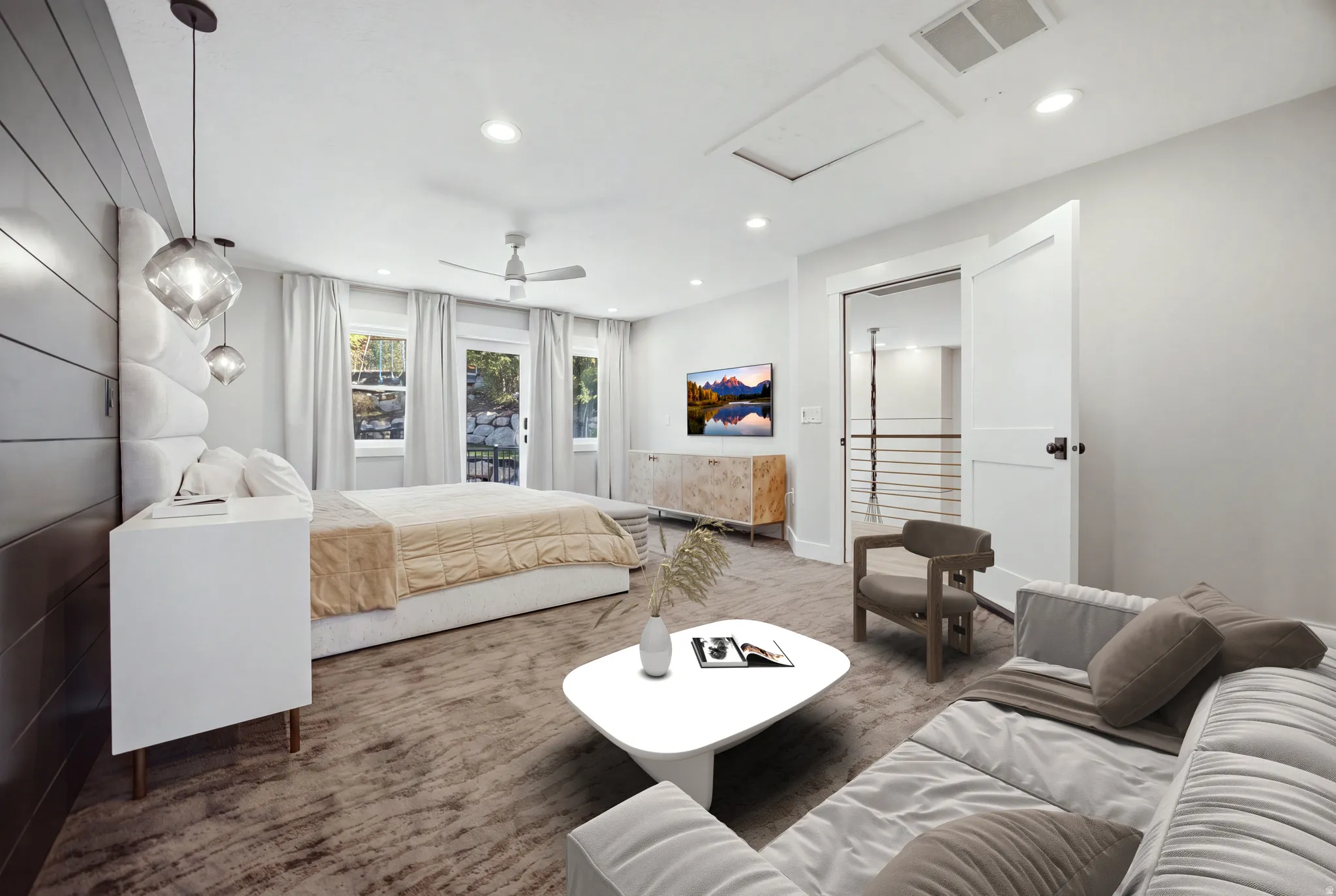 Recessed lighting, ceiling fan, white paneled door with black hardware, and wood-paneled accent wall