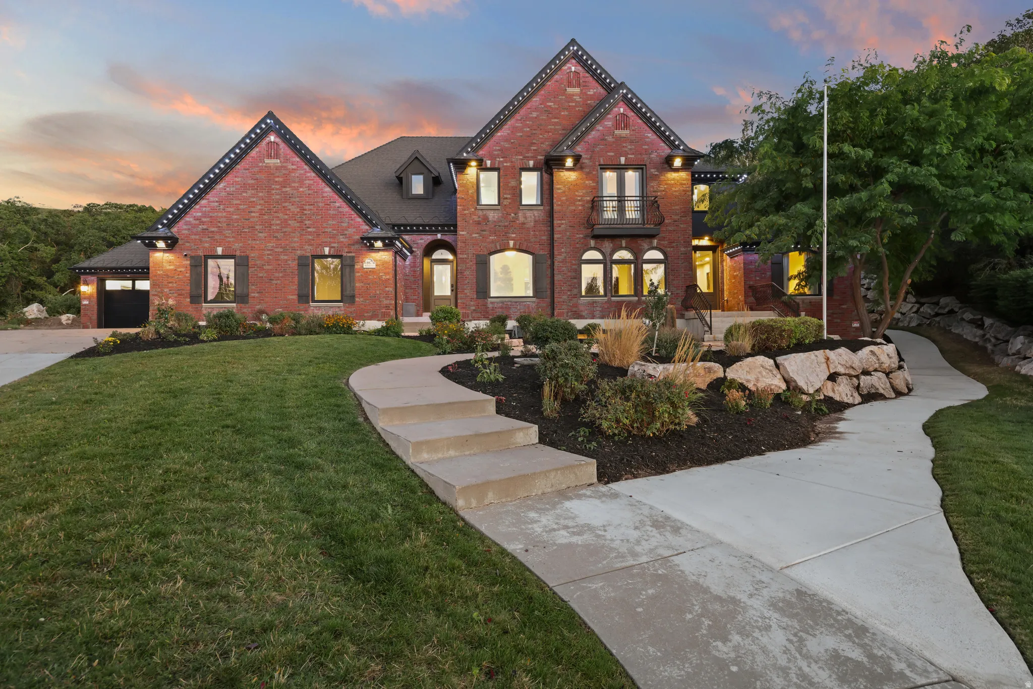 Brick exterior with dark trim accents, multiple gables, and a prominent front entrance