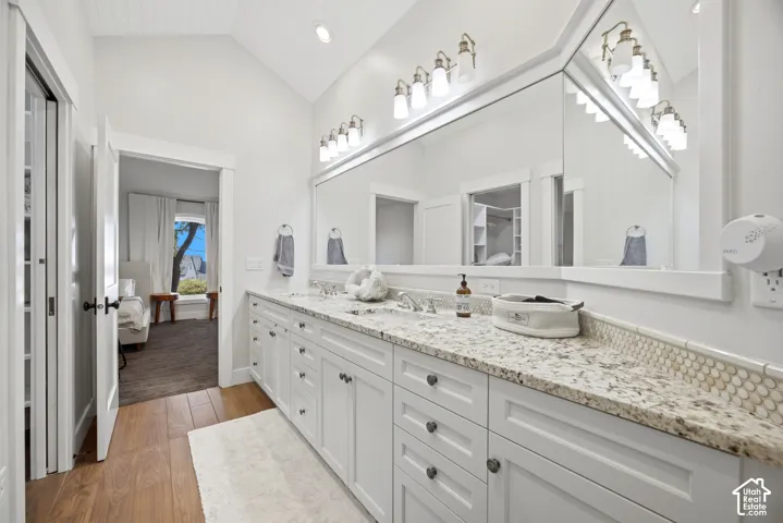 Dual vanity with light-toned countertop and integrated sinks