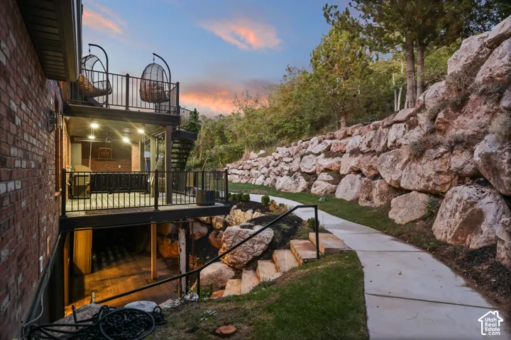 Brick exterior with multi-level decks featuring black railings