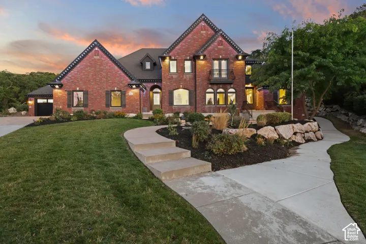 Brick exterior with dark trim accents, multiple gables, and a prominent front entrance