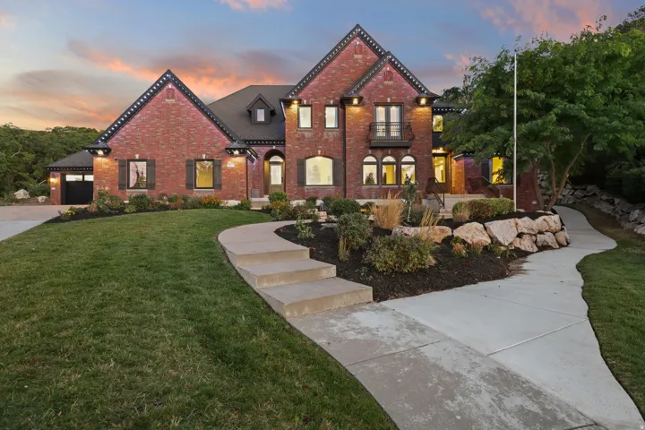 Brick exterior with dark trim accents, multiple gables, and a prominent front entrance