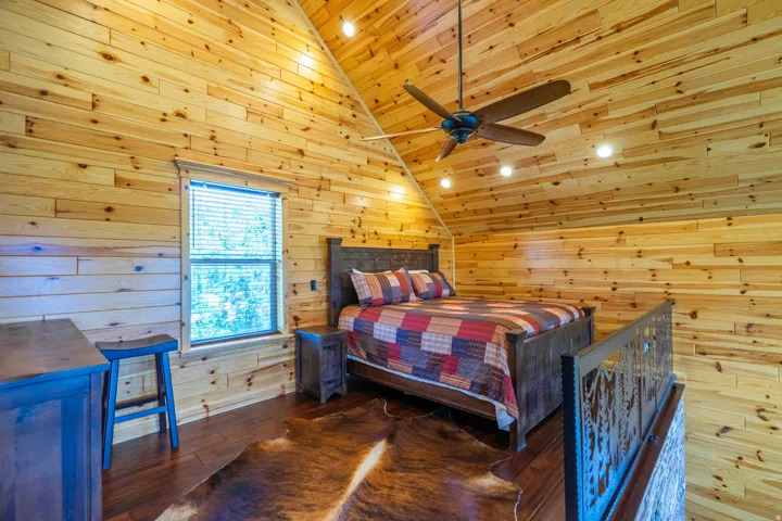 Wood-paneled walls and ceiling with recessed lighting