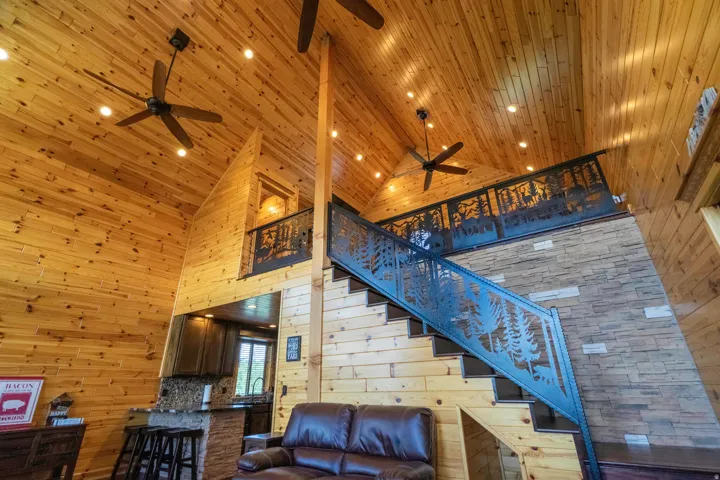 Vaulted ceilings with wood paneling and recessed lighting