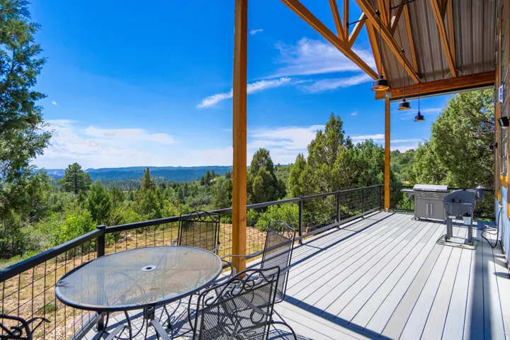 Expansive composite decking with metal railing