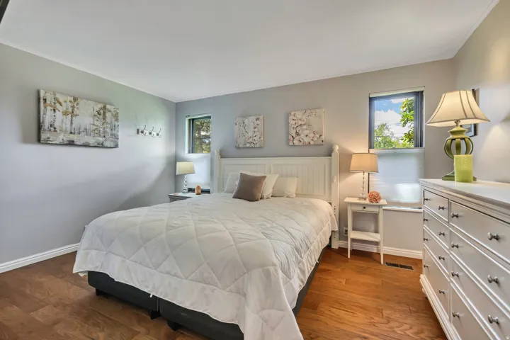Hardwood flooring and light gray wall paint