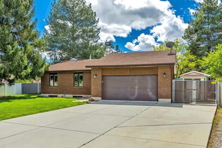 Brick exterior with an attached two-car garage