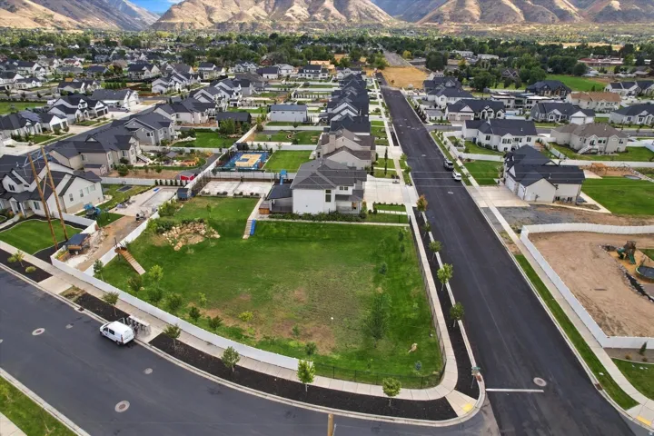 Expansive corner lot with a level, grass-covered terrain