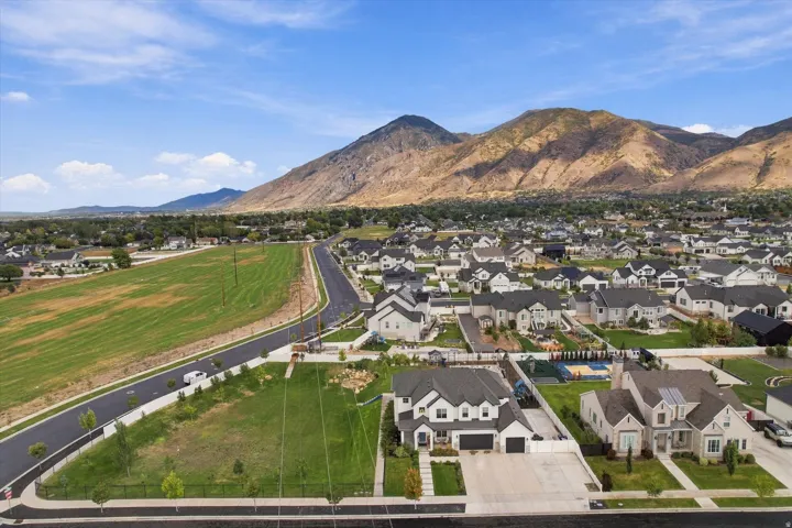 Beautiful mountain backdrop with a developed residential area featuring new construction homes