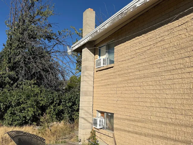 Brick exterior with a stone-finish chimney
