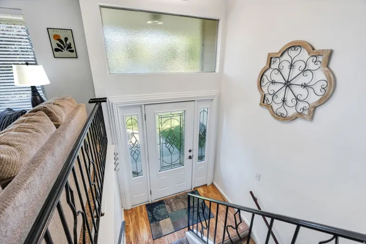 Light-filled entryway with beautiful glass front door