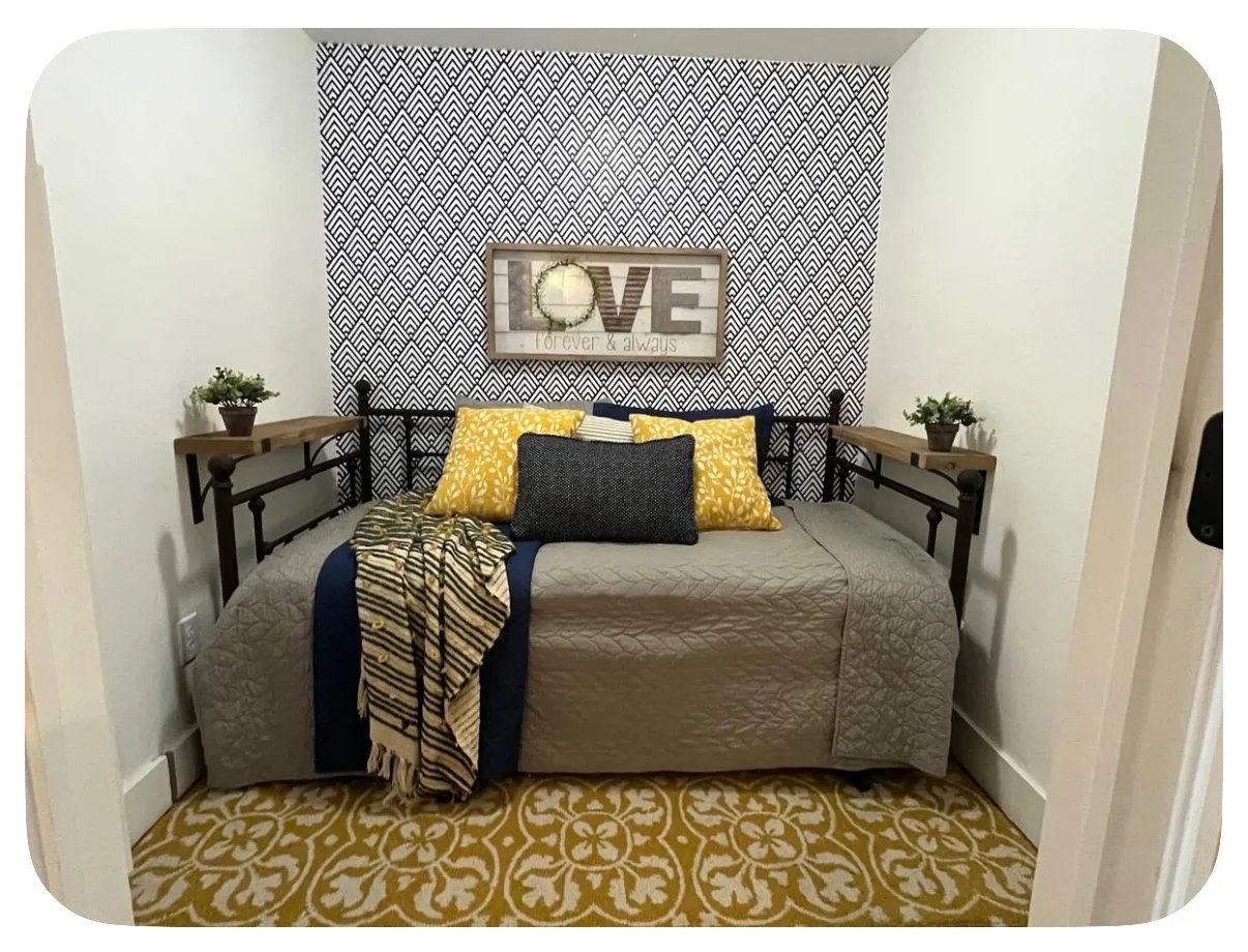 Accent wall featuring geometric pattern wallpaper