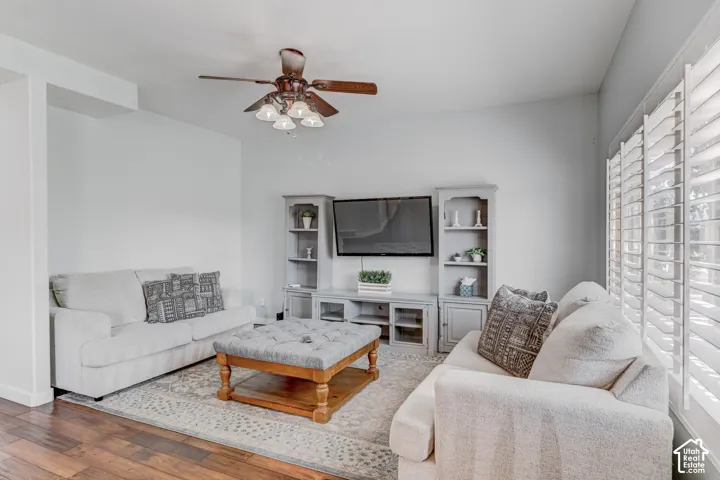 Wood-finish flooring with a ceiling fan light fixture