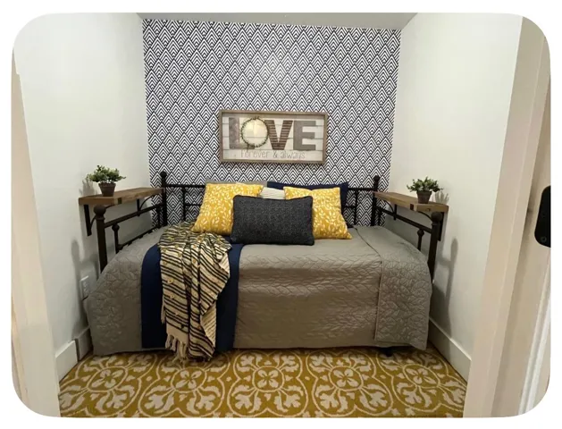 Accent wall featuring geometric pattern wallpaper