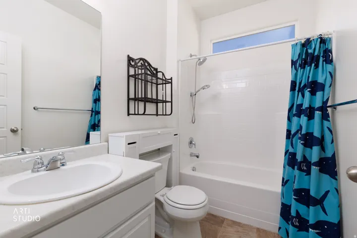 White vanity with an integrated sink and chrome faucet