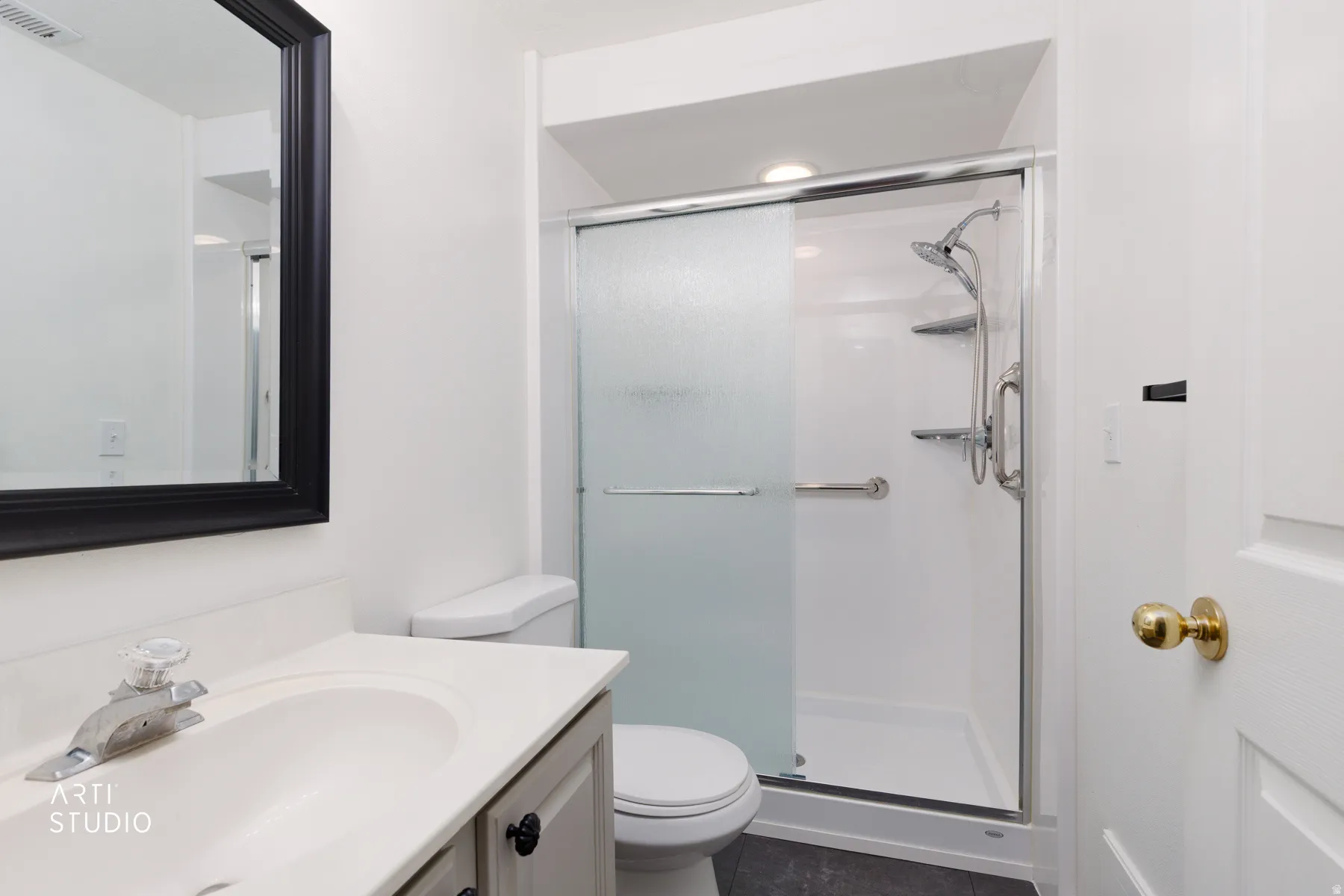 White vanity with an integrated sink and chrome faucet