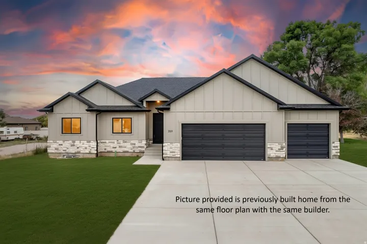 Siding exterior with stone accents, dark-framed windows, a two-car garage, and a single-car garage