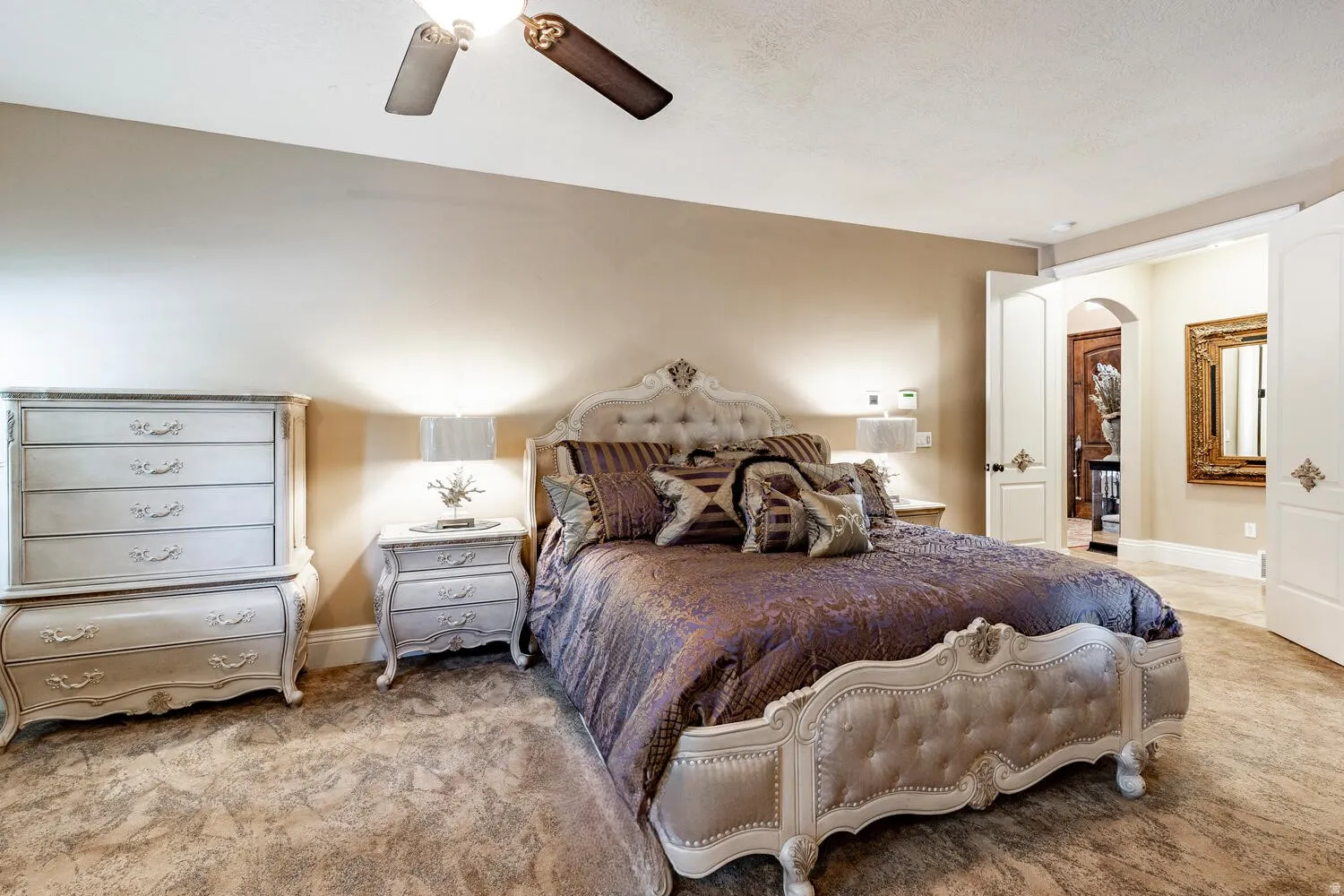 Interior room featuring light-colored walls and a ceiling fan
