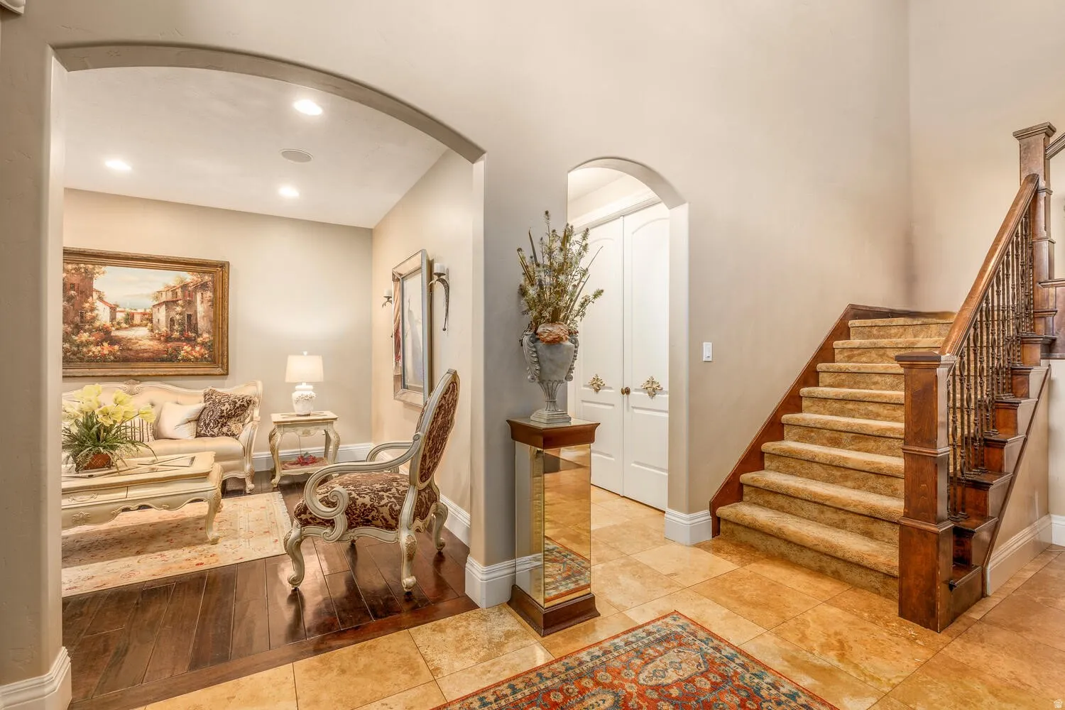 Arched entryway featuring recessed lighting