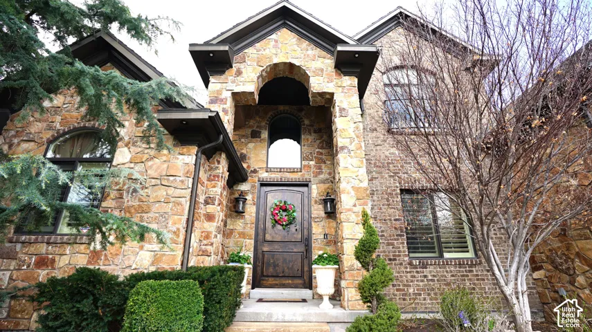 Stone and brick exterior with an arched entryway