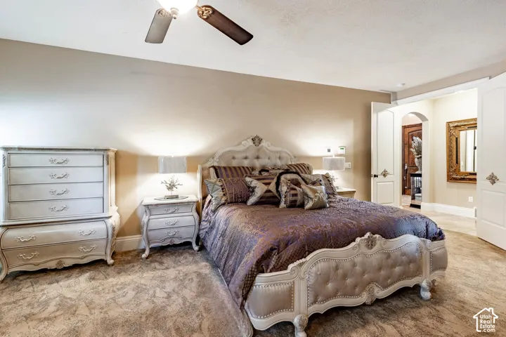 Interior room featuring light-colored walls and a ceiling fan