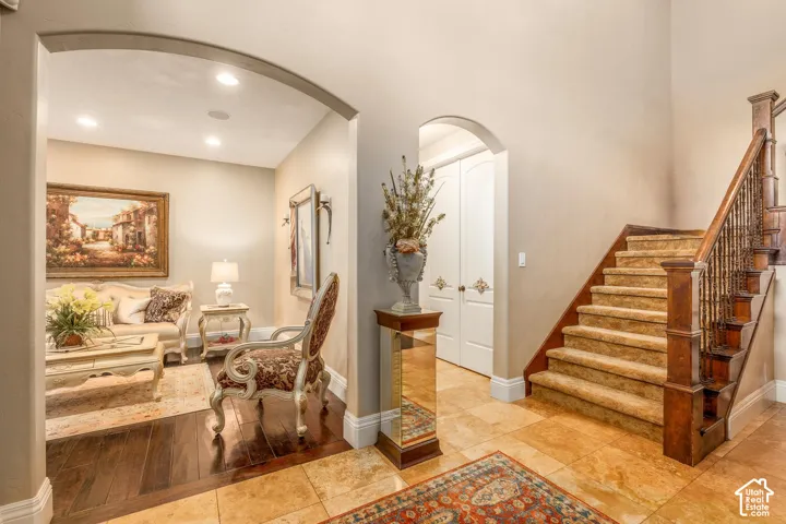 Arched entryway featuring recessed lighting