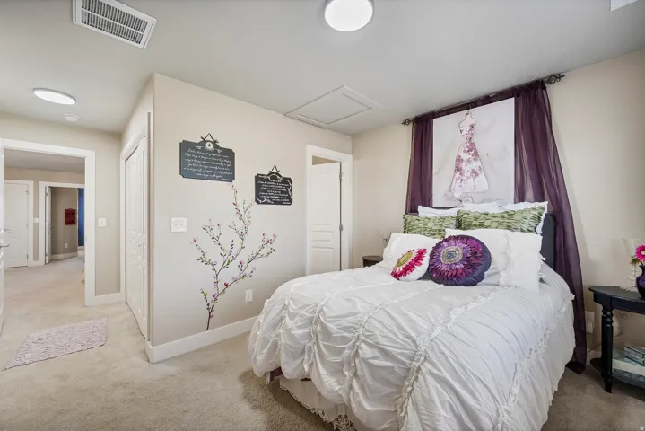 Bedroom 4. Carpeted bedroom with neutral wall tones
