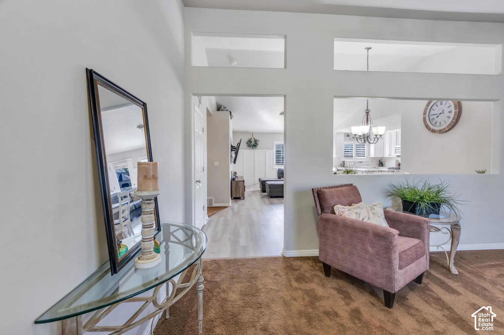 Architectural wall cut-outs, light-colored wall paint, white trim, and a carpeted floor