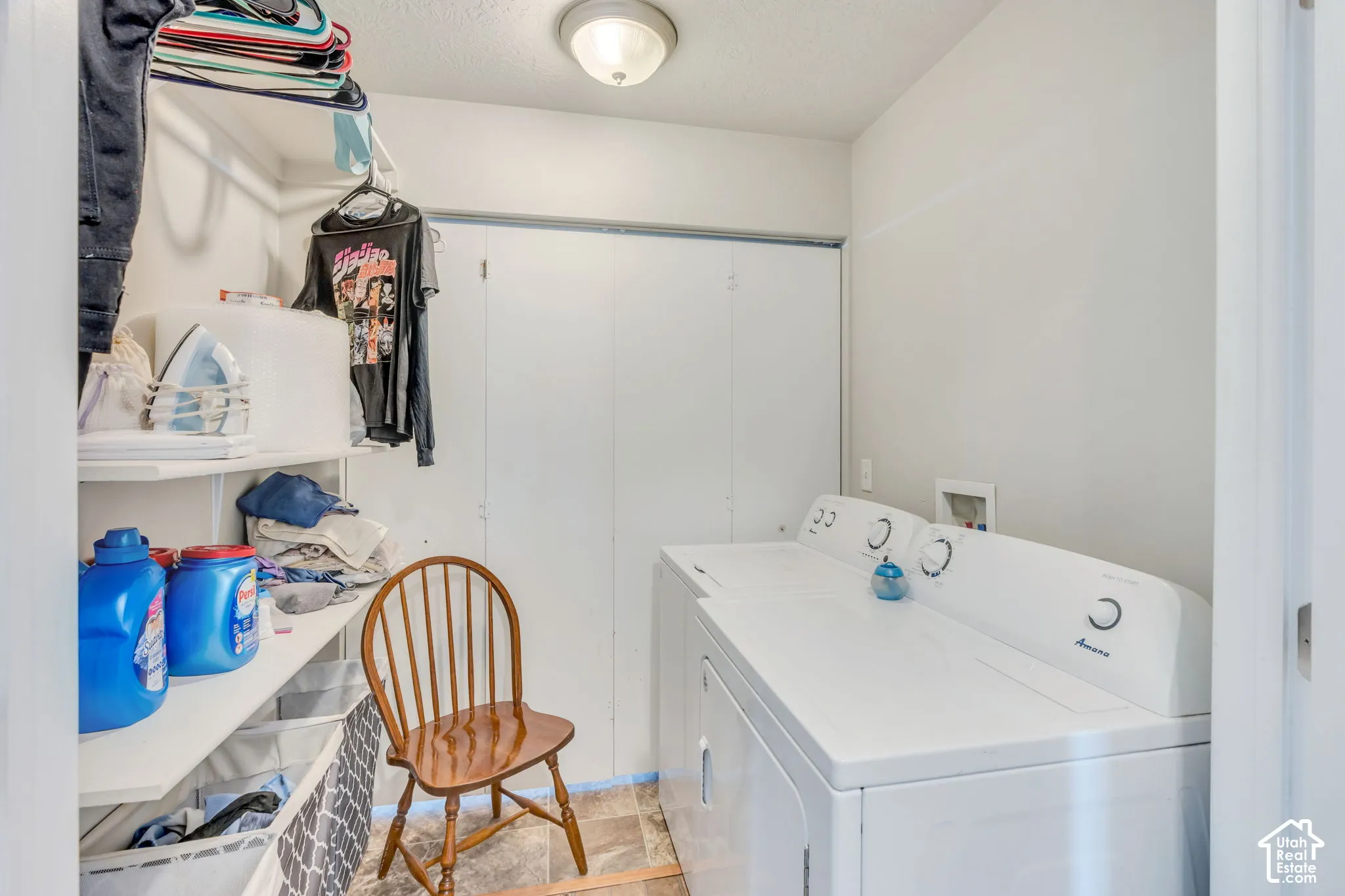 Large Laundry area with shelving.