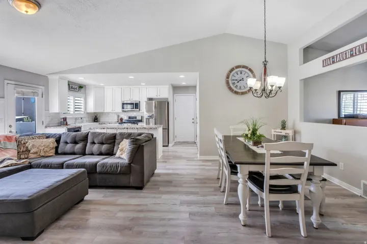 Great Open Area. Vaulted ceiling over dining area with chandelier with view of Living Room and Kitchen.