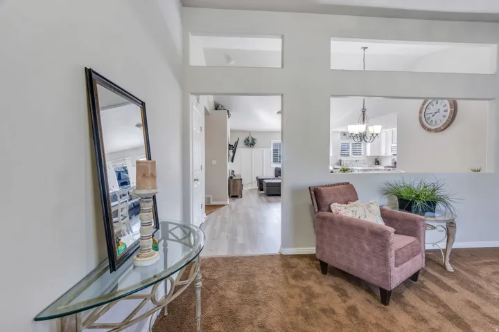 Architectural wall cut-outs, light-colored wall paint, white trim, and a carpeted floor
