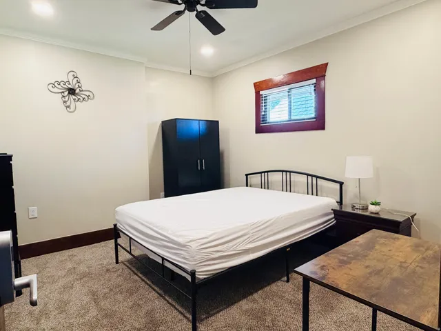 Recessed lighting, crown molding, ceiling fan, and carpeted flooring