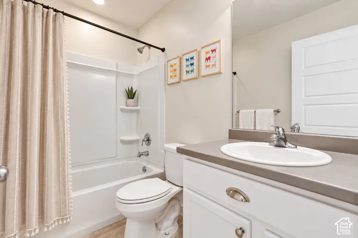Upstairs bathroom with a shower tub combo