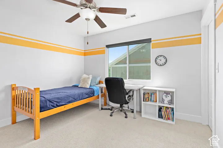 Good size bedroom featuring a large window and large walk in closet