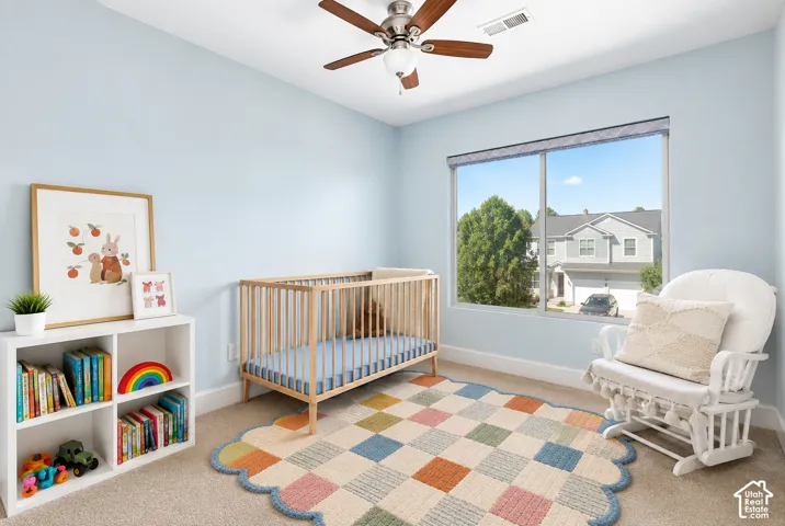 Good size bedroom featuring a large window and walk in closet with a window