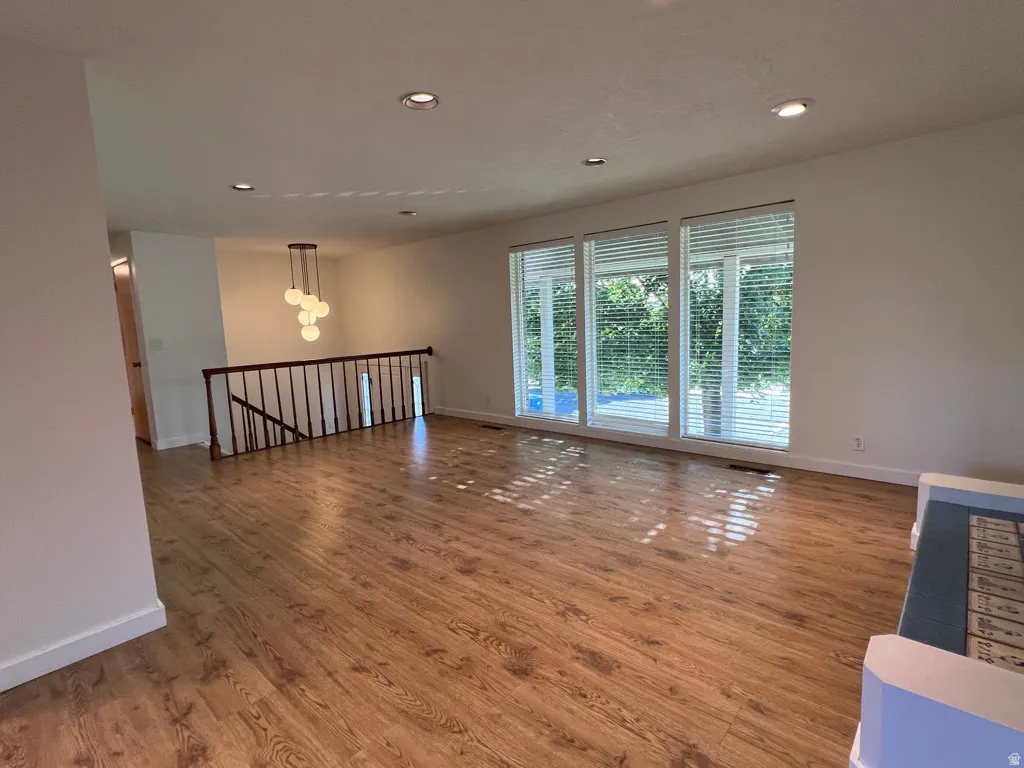 Here is the living room without furnishings.  Spherical chandelier stays.